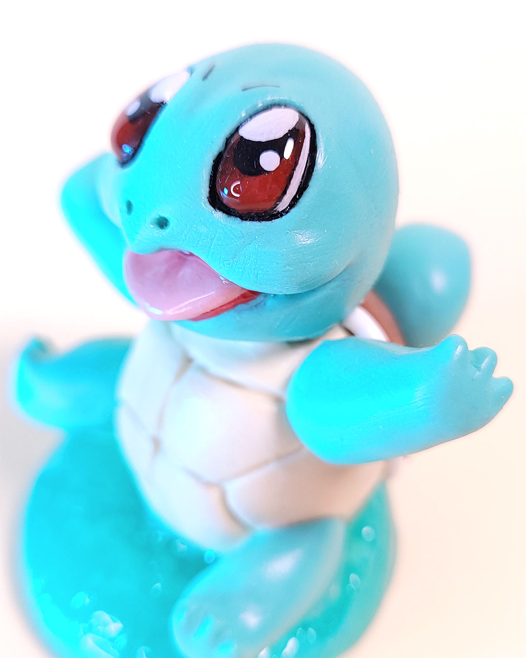 Mini figurine du Pokémon Carapuce, ressemblant à une tortue bleue turquoise